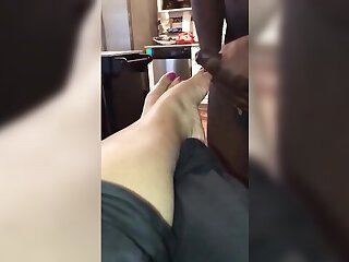 Amateur foot fetish video of lady receiving a perfect footjob from sexy lady with pink toe nails